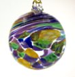 GALW: gold, purple, aqua, green, lapis mix on opal white Spiral pattern